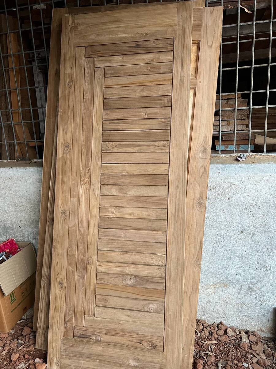 Finished teak door, Sri Shiva Saw Mills workshop