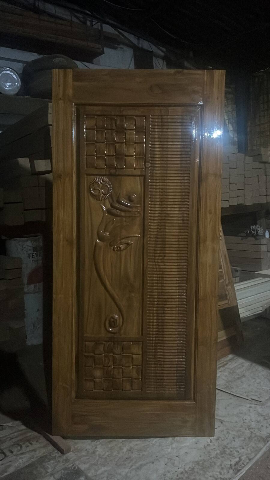 Teak door with carved Ganesha motif, Sri Shiva Saw Mills workshop